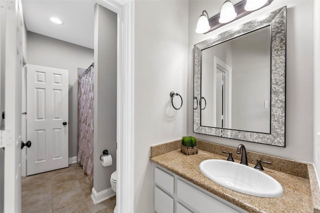 bathroom featuring vanity, toilet, tile patterned floors, and a shower with curtain