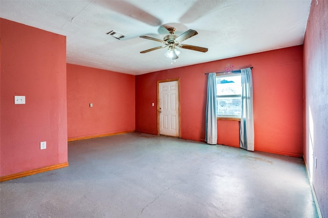 unfurnished room featuring a textured ceiling and ceiling fan