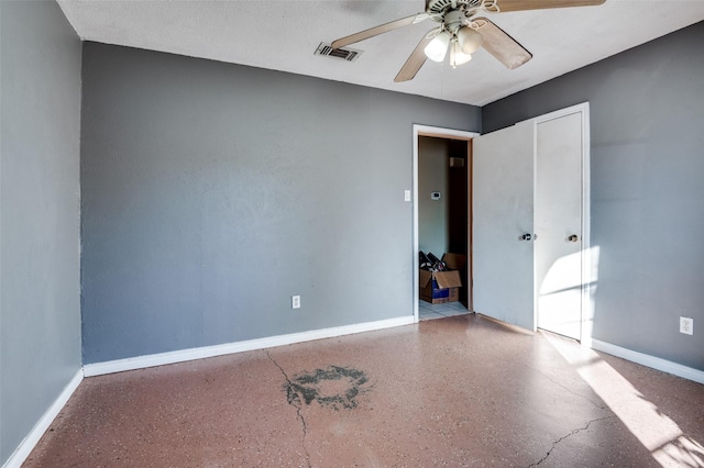 empty room featuring ceiling fan