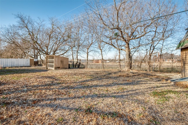 view of yard with an outbuilding and a rural view