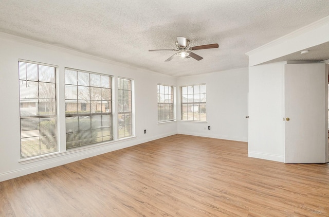 empty room featuring ceiling fan, a textured ceiling, and light hardwood / wood-style flooring