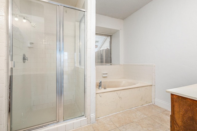 bathroom featuring tile patterned flooring, shower with separate bathtub, and a textured ceiling