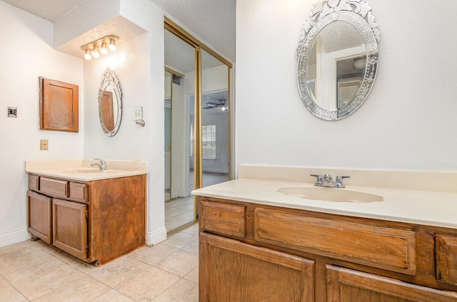 bathroom featuring tile patterned floors and vanity