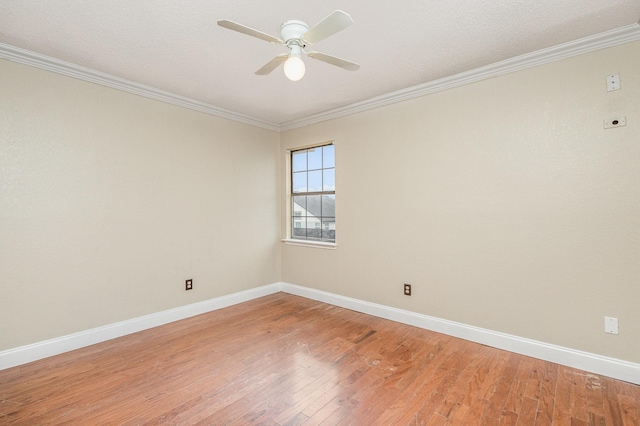 unfurnished room featuring ceiling fan, ornamental molding, and hardwood / wood-style floors