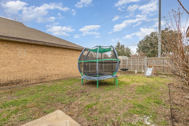 view of yard with a trampoline