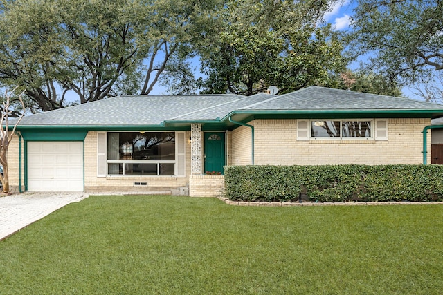 ranch-style home with a garage and a front lawn