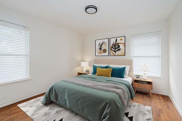 bedroom with hardwood / wood-style flooring