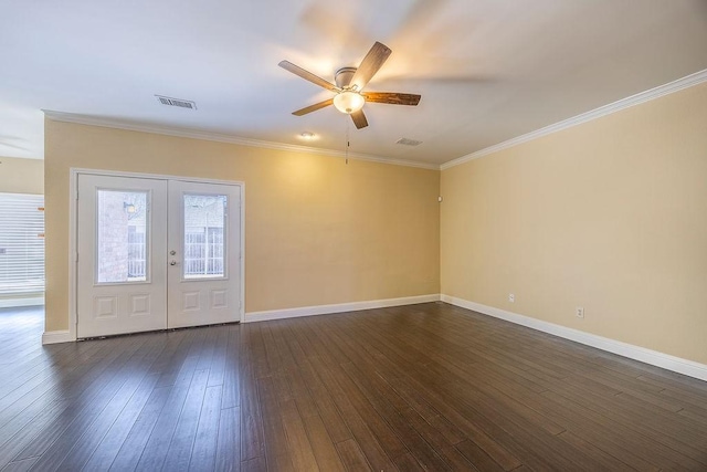 unfurnished room with ornamental molding, dark hardwood / wood-style floors, ceiling fan, and french doors