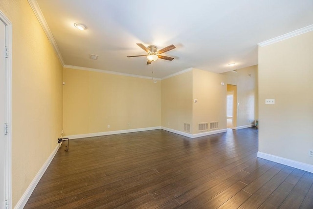 spare room with ornamental molding, dark hardwood / wood-style floors, and ceiling fan