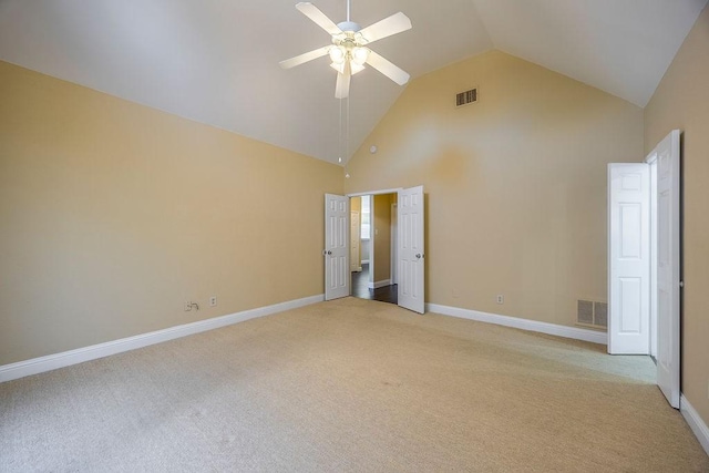 unfurnished bedroom featuring high vaulted ceiling, light colored carpet, and ceiling fan