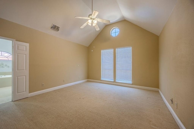 unfurnished room with ceiling fan, light colored carpet, and lofted ceiling