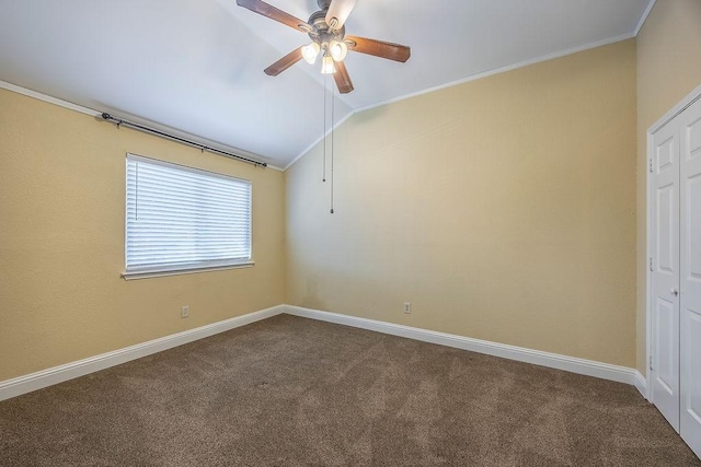 unfurnished room with vaulted ceiling, ornamental molding, and carpet