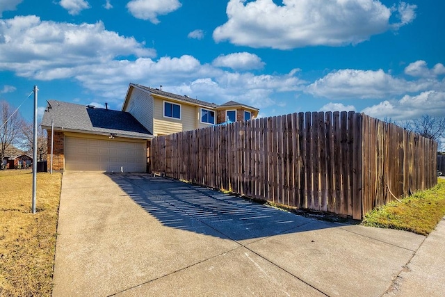 view of gate featuring a garage