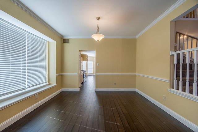 unfurnished room featuring crown molding and dark hardwood / wood-style floors