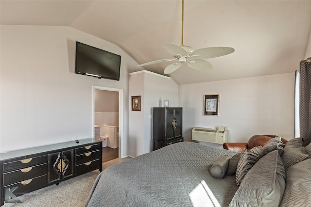 carpeted bedroom featuring ceiling fan, a wall mounted AC, vaulted ceiling, and ensuite bath