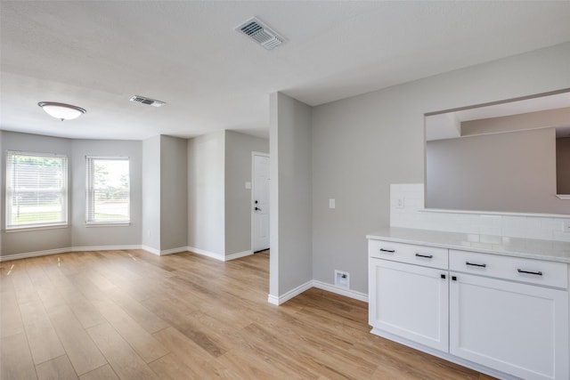 unfurnished living room with light hardwood / wood-style floors