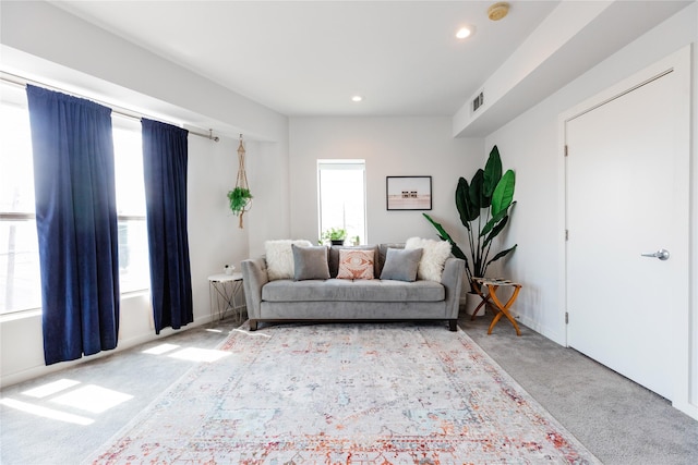 living room with light colored carpet