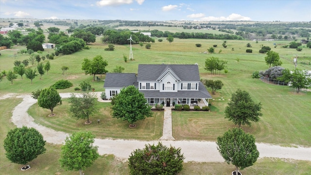 birds eye view of property featuring a rural view