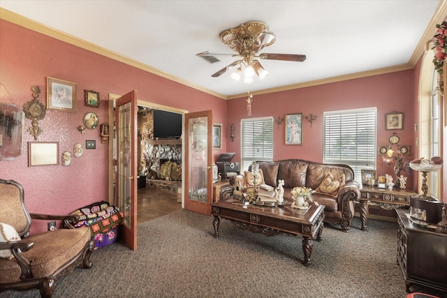 living room featuring crown molding, carpet floors, and ceiling fan