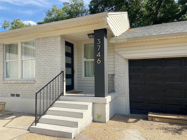 property entrance with a garage