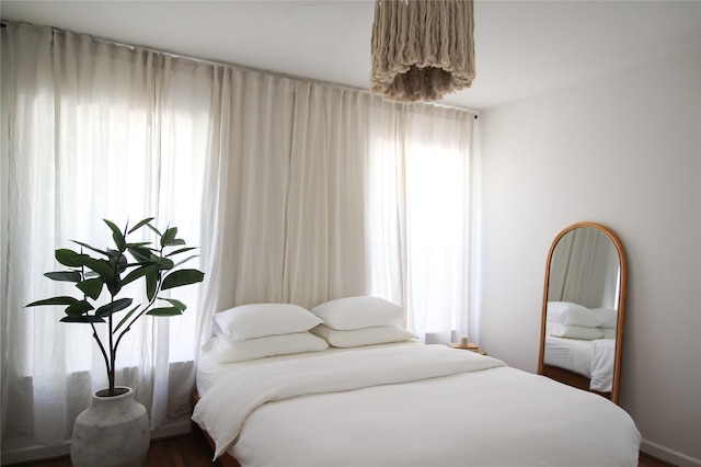 bedroom with hardwood / wood-style floors