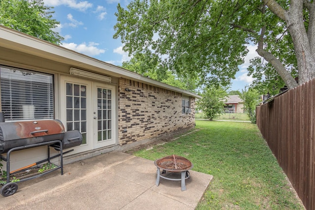 7221 Chinaberry Rd, Dallas, TX 75249 - view of yard with french doors, a patio, and a fire pit