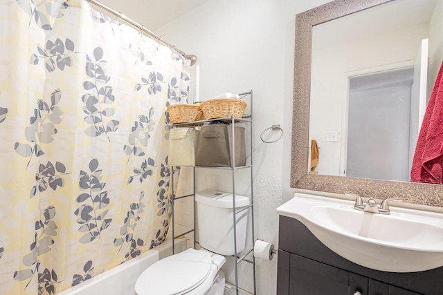 7221 Chinaberry Rd, Dallas, TX 75249 - full bathroom with vanity, shower / bath combo with shower curtain, and toilet