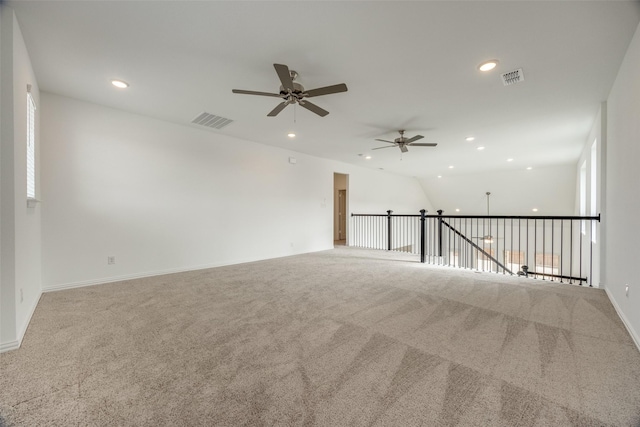 unfurnished room with light colored carpet