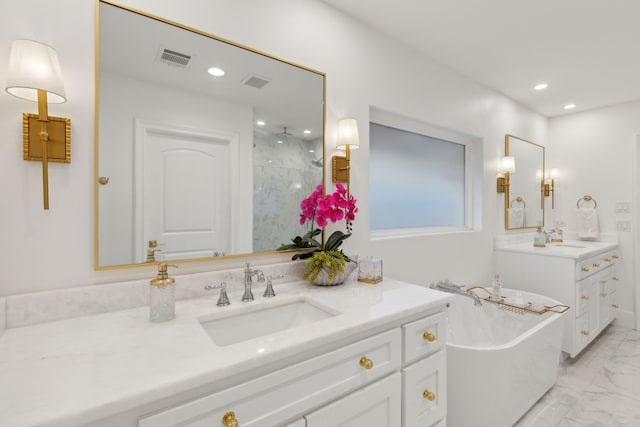 bathroom with vanity and independent shower and bath