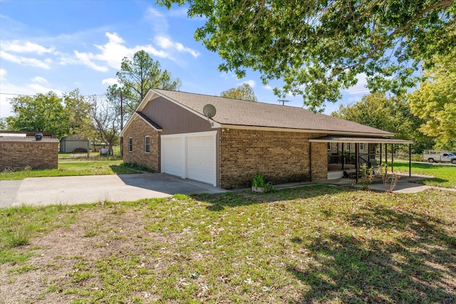 view of home's exterior featuring a garage and a lawn