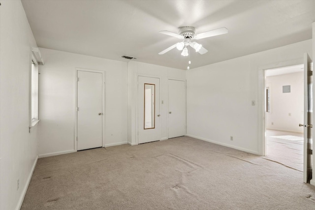 carpeted empty room with ceiling fan