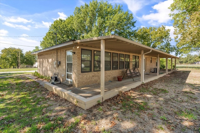 view of property exterior featuring a patio