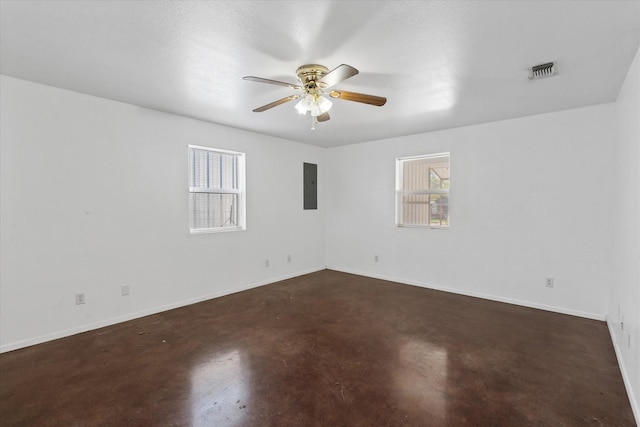 unfurnished room featuring ceiling fan and electric panel