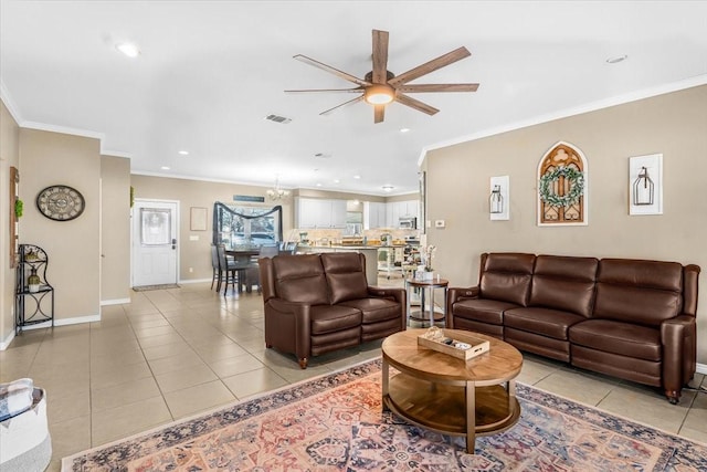 living room featuring light tile patterned flooring and ornamental molding