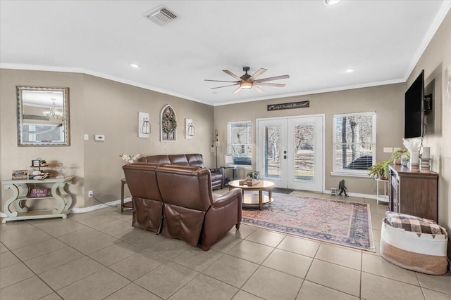 living room with crown molding, light tile patterned flooring, ceiling fan, and french doors