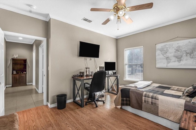 bedroom with light wood-type flooring, ceiling fan, and ornamental molding