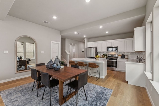 dining area with light hardwood / wood-style flooring