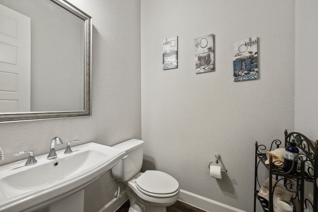 bathroom with sink and toilet