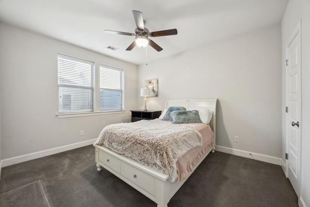 bedroom with dark carpet and ceiling fan