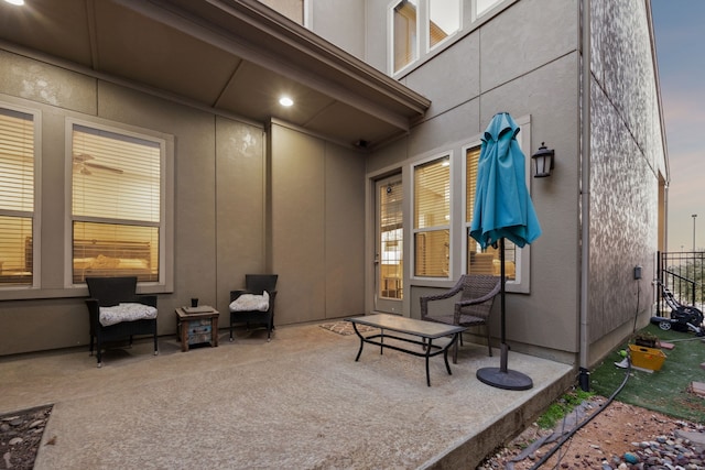 view of patio terrace at dusk