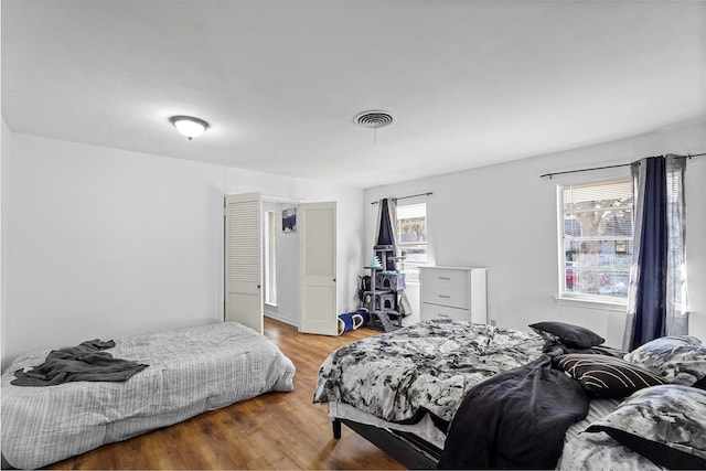 bedroom featuring wood-type flooring