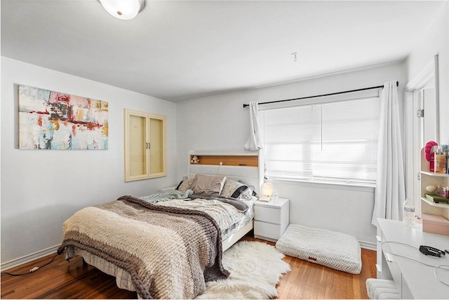 bedroom with wood-type flooring