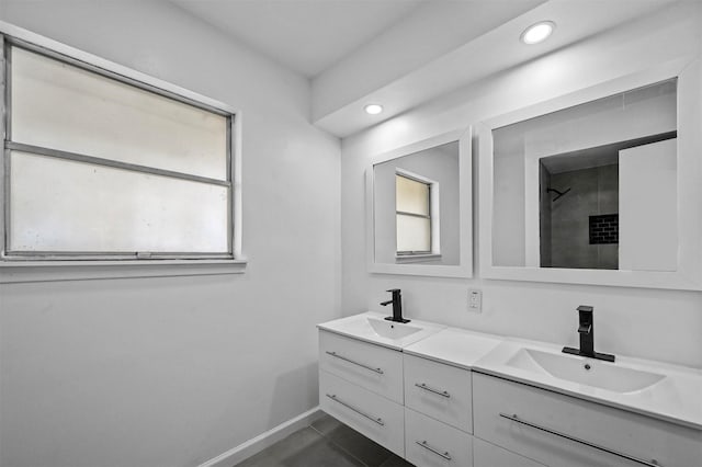 bathroom with vanity, a shower, and tile patterned floors