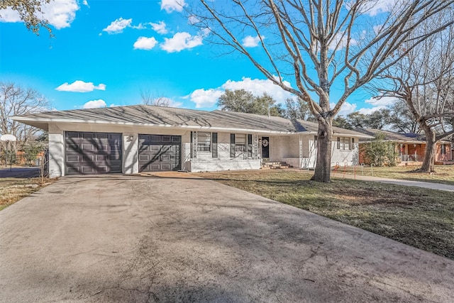 single story home featuring a garage, covered porch, and a front yard