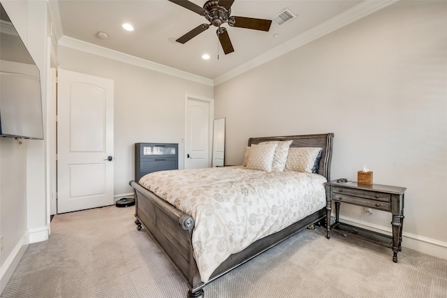 carpeted bedroom with ornamental molding and ceiling fan