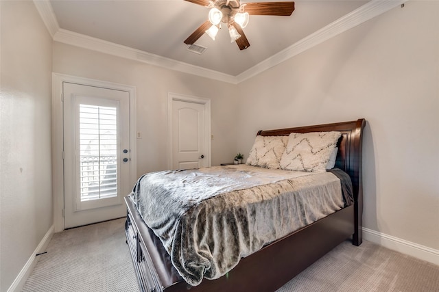 carpeted bedroom featuring ornamental molding and ceiling fan