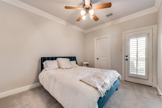 carpeted bedroom featuring ornamental molding and ceiling fan