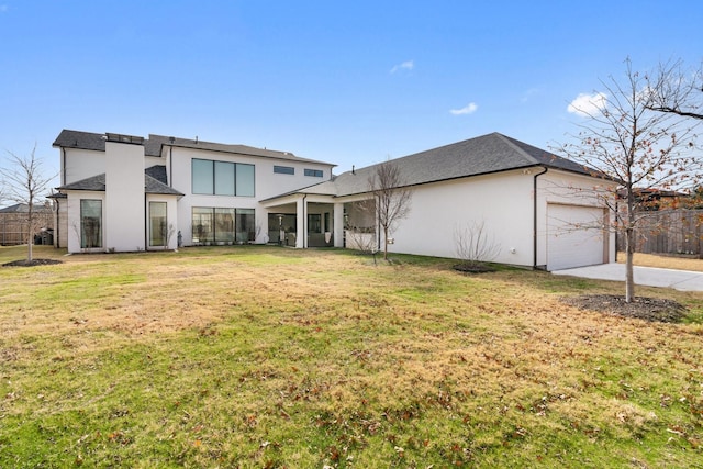 view of front of property with a front yard and a garage