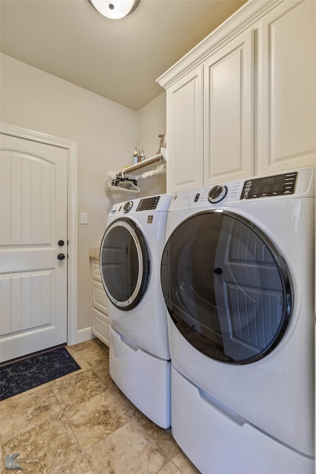 laundry area featuring cabinets and washer and dryer