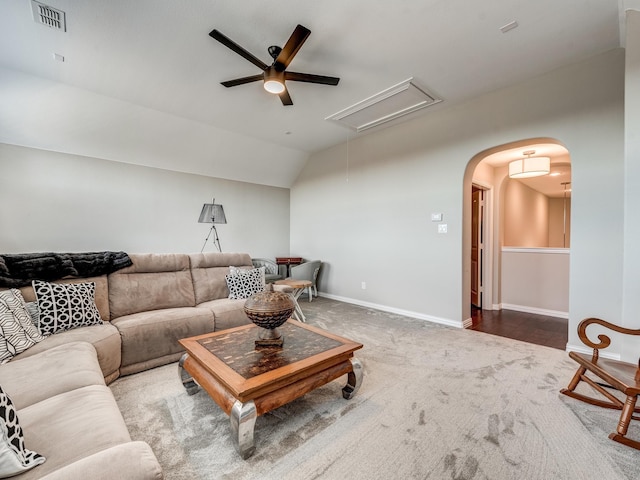 living room with lofted ceiling, carpet flooring, and ceiling fan